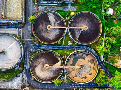 Aerial view of round tanks at a sewage treatment works