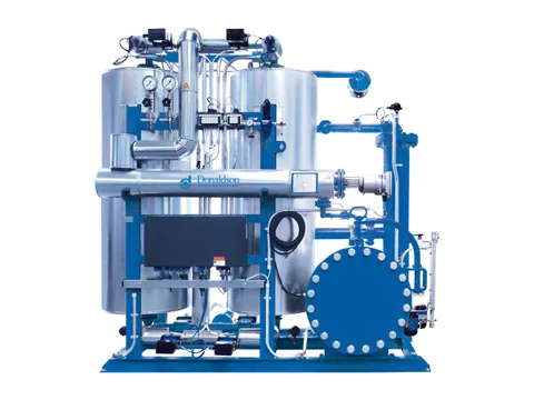 A skid-mounted gas drying unit with two vessels, a heat exchanger, gauges and a large flanged cover