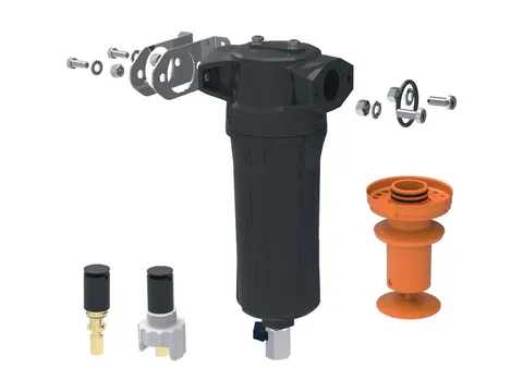 A centrifugal moisture separator with its swirl insert, drains and mounting parts laid out around it