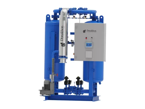 A twin-tower heated desiccant dryer with its control cabinet and purge heater