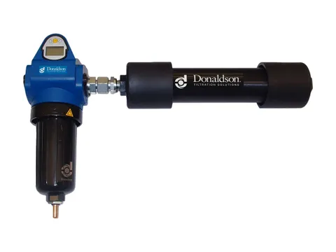 A membrane dryer module mounted beside its coalescing filter with a digital indicator on the filter head